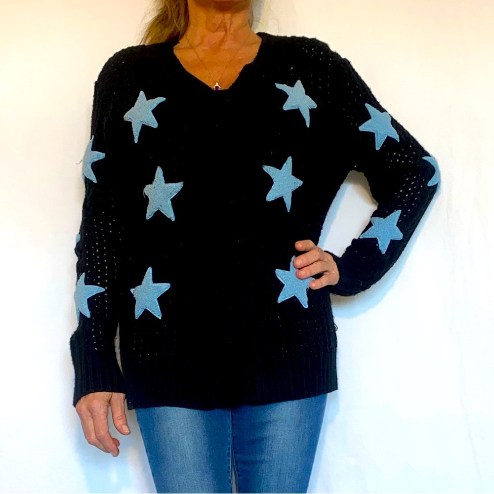 Hand knitted sweater with blue stars.